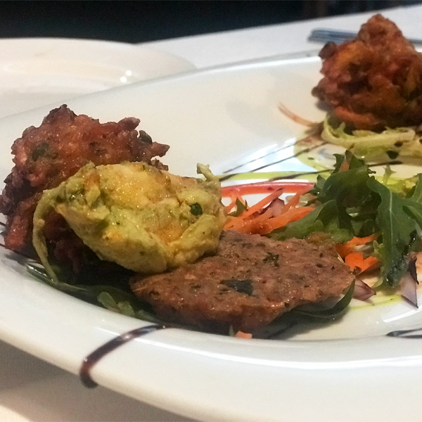 Indian food attractively presented on a round plate